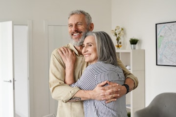 elderly couple looking happy and healthy